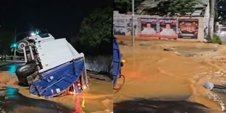 Caminhão de lixo cai em cratera na avenida Coronel Teixeira