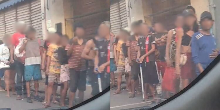 Moradores de rua recebendo entorpecentes