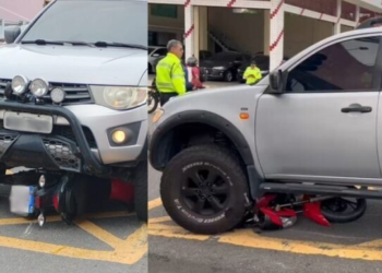 Motociclista vai parar debaixo de picape no centro de Manaus