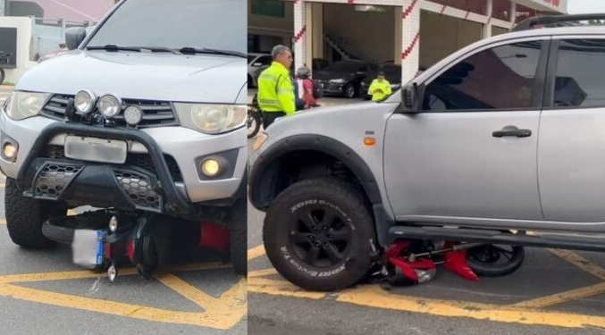 Motociclista vai parar debaixo de picape no centro de Manaus