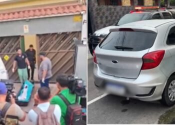 O corpo do assaltante sendo removido pelos agentes do IML