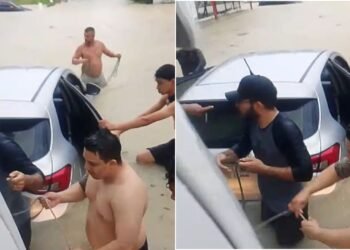 Motorista fica com carro parcialmente submerso