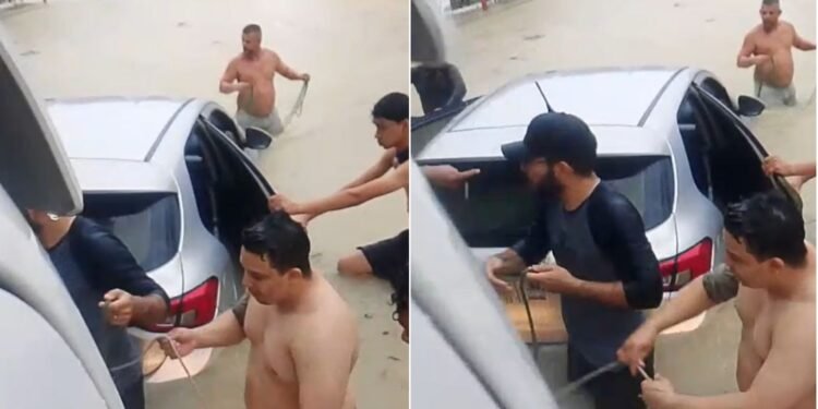 Motorista fica com carro parcialmente submerso