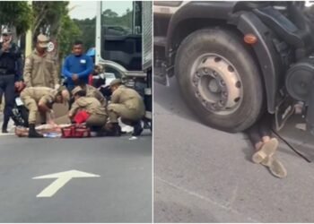 Motociclista fica ferido após colisão e vai parar embaixo de caminhão na avenida do Turismo