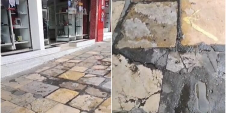 Água escorre pela calçada e aposentada cobra solução vazamento no Centro